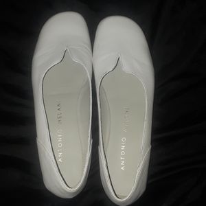 White Antonio Melani flats.
